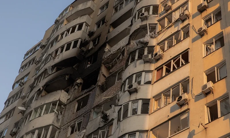 A man looks out from a burned apartment in a residential building damaged during a Russian air strike in Kyiv on June 6, 2025, amid the Russian invasion of Ukraine. Russia carried out a barrage of drone strikes across Ukraine overnight, killing at least four people and wounding 20 in the capital Kyiv, Ukrainian officials said on June 6. (Photo by Roman PILIPEY / AFP) (Photo by ROMAN PILIPEY/AFP via Getty Images)