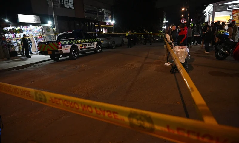 Police stand guard at the crime scene where Senator Miguel Uribe Turbay was shot and wounded in the Modelia neighborhood in Bogota on June 7, 2025. A Colombian right-wing opposition senator and candidate for next year's presidential election, Miguel Uribe Turbay, 39, was shot and wounded in Bogota on June 7, 2025, various media reported, while the government denounced an "attack." (Photo by Raul ARBOLEDA / AFP) (Photo by RAUL ARBOLEDA/AFP via Getty Images)