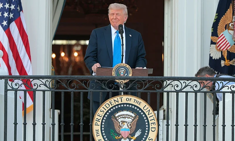 WASHINGTON, DC - JUNE 04: U.S. President Donald Trump speaks to guests from the South Portico of the White House during an event on the South Lawn on June 04, 2025 in Washington, DC. Trump held the “Summer Soirée” for guests, including staff, cabinet members, and supporters to visit the grounds and enjoy the recent onset of summer heat. (Photo by Anna Moneymaker/Getty Images)
