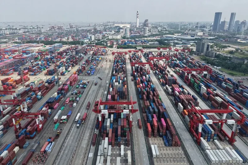 Shipping containers are stacked at a port in Shanghai on June 9, 2025. Chinese exports grew slower than expected in May, according to official data on June 9, as shipments to the United States tumbled amid global trade turmoil triggered by Donald Trump's tariff blitz. (Photo by AFP) / China OUT (Photo by -/AFP via Getty Images)