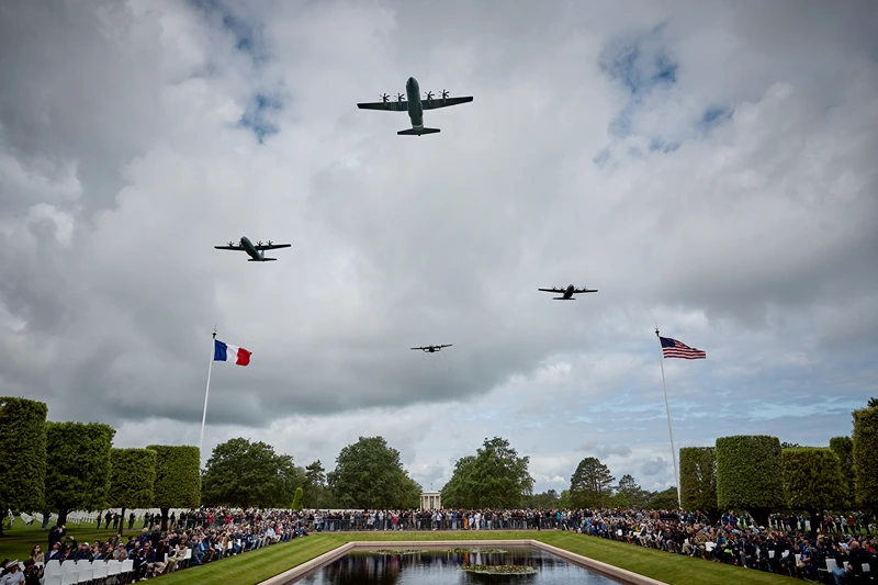 COLLEVILLE-SUR-MER, FRANCE - JUNE 06: US Military aircraft perform a flyover during a ceremony to mark the 81st anniversary of the D-Day landings during World War II at the Normandy American Cemetery on June 06, 2025 in Colleville-sur-Mer, France. Today marks the 81st Anniversary of 'Operation Overlord', the Allied invasion of Normandy during World War II that led to the liberation of Western Europe and eventual defeat of Nazi Germany. (Photo by Kiran Ridley/Getty Images)