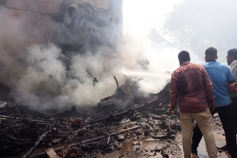 Firefighters work at the site where Air India flight 171 crashed in a residential area near the airport in Ahmedabad on June 12, 2025. The London-bound passenger plane crashed on June 12 in India's western city of Ahmedabad with 242 on board, aviation officials said in what the airline called a "tragic accident". (Photo by Sam PANTHAKY / AFP) (Photo by SAM PANTHAKY/AFP via Getty Images)