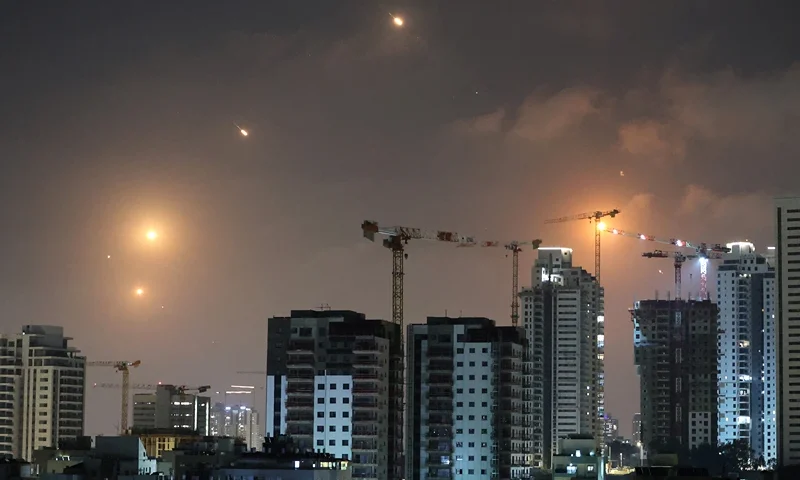 This picture shows rocket trails in the sky above Netanya on June 13, 2025. Air raid sirens sounded in Jerusalem and loud blasts were heard on June 13, AFP journalists reported, as the Israeli military said it had detected a missile launched from Iran. (Photo by JACK GUEZ / AFP) (Photo by JACK GUEZ/AFP via Getty Images)
