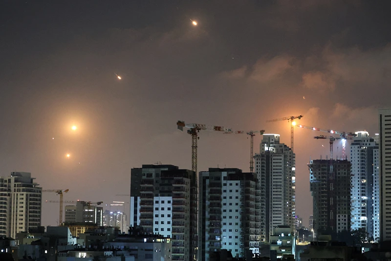 This picture shows rocket trails in the sky above Netanya on June 13, 2025. Air raid sirens sounded in Jerusalem and loud blasts were heard on June 13, AFP journalists reported, as the Israeli military said it had detected a missile launched from Iran. (Photo by JACK GUEZ / AFP) (Photo by JACK GUEZ/AFP via Getty Images)