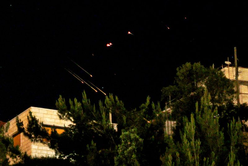 Debris of missiles fired from Iran toward Israel leave trails in the night sky over the Israel-annexed Golan Heights after being intercepted on June 13, 2025. (Photo by Jalaa MAREY / AFP) (Photo by JALAA MAREY/AFP via Getty Images)