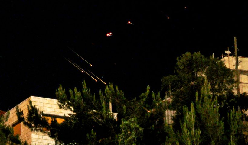 Debris of missiles fired from Iran toward Israel leave trails in the night sky over the Israel-annexed Golan Heights after being intercepted on June 13, 2025. (Photo by Jalaa MAREY / AFP) (Photo by JALAA MAREY/AFP via Getty Images)