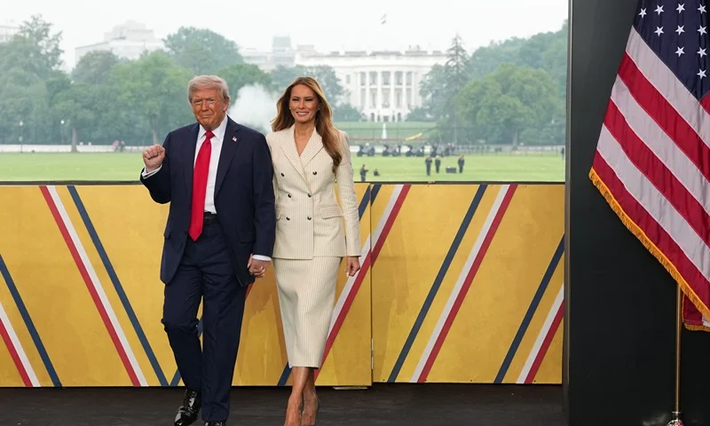 US President Donald Trump and First Lady Melania Trump attend the Army 250th Anniversary Parade in Washington, DC on June 14, 2025. Trump's long-held dream of a parade will come true as nearly 7,000 troops plus dozens of tanks and helicopters rumble through the capital in an event officially marking the 250th anniversary of the US army. (Photo by Doug MILLS / POOL / AFP) (Photo by DOUG MILLS/POOL/AFP via Getty Images)