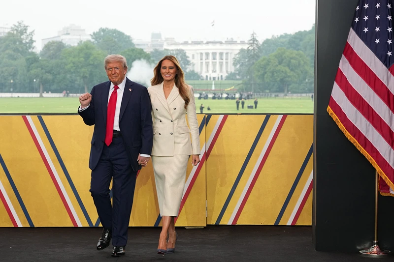 US President Donald Trump and First Lady Melania Trump attend the Army 250th Anniversary Parade in Washington, DC on June 14, 2025. Trump's long-held dream of a parade will come true as nearly 7,000 troops plus dozens of tanks and helicopters rumble through the capital in an event officially marking the 250th anniversary of the US army. (Photo by Doug MILLS / POOL / AFP) (Photo by DOUG MILLS/POOL/AFP via Getty Images)