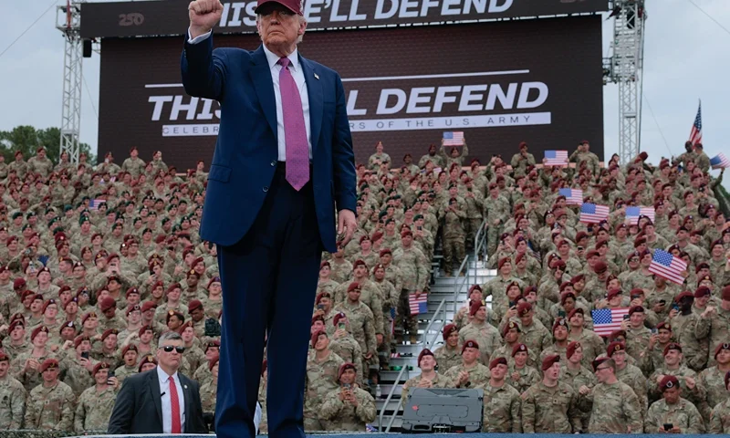 President Donald Trump pumps his fist as he leaves the stage during a rally with U.S. Army troops on June 10, 2025 at Fort Bragg, North Carolina. Trump is traveling to Fort Bragg Army base to observe a military demonstration and give remarks in honor of the U.S. Army’s 250th anniversary. (Photo by Anna Moneymaker/Getty Images)