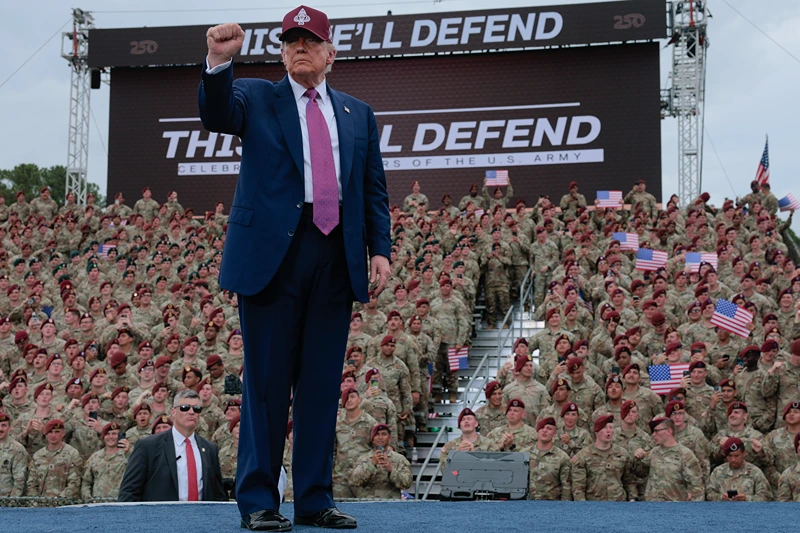 President Donald Trump pumps his fist as he leaves the stage during a rally with U.S. Army troops on June 10, 2025 at Fort Bragg, North Carolina. Trump is traveling to Fort Bragg Army base to observe a military demonstration and give remarks in honor of the U.S. Army’s 250th anniversary. (Photo by Anna Moneymaker/Getty Images)