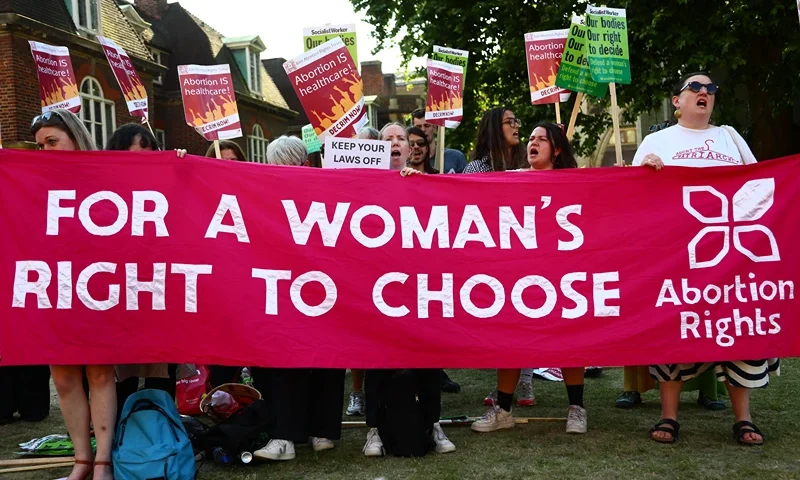 Protesters from pro-choice group 'Abortion Rights' gather near Parliament, where MPs are voting on the decriminalisation of abortion on June 17, 2025 in London, United Kingdom. In a free vote held in Parliament on Tuesday, MP's are considering two separate amendments to the Crime and Policing Bill, brought forward by Labour MPs Tonia Antoniazzi and Stella Creasey, which both seek to decriminalise abortion in England and Wales. Although abortion is allowed up to 24 weeks under certain criteria laid out in the 1967 Abortion Act, women can still be prosecuted for terminating pregnancies under the Victorian-era 'Offences Against the Person Act' which makes it a crime for a woman to "procure her own miscarriage." (Photo by Alishia Abodunde/Getty Images)