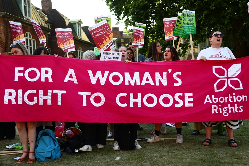 Protesters from pro-choice group 'Abortion Rights' gather near Parliament, where MPs are voting on the decriminalisation of abortion on June 17, 2025 in London, United Kingdom. In a free vote held in Parliament on Tuesday, MP's are considering two separate amendments to the Crime and Policing Bill, brought forward by Labour MPs Tonia Antoniazzi and Stella Creasey, which both seek to decriminalise abortion in England and Wales. Although abortion is allowed up to 24 weeks under certain criteria laid out in the 1967 Abortion Act, women can still be prosecuted for terminating pregnancies under the Victorian-era 'Offences Against the Person Act' which makes it a crime for a woman to "procure her own miscarriage." (Photo by Alishia Abodunde/Getty Images)