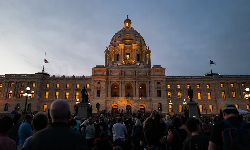 ST. PAUL, MINNESOTA - JUNE 18: People attend a candlelight vigil outside the state Capitol building on June 18, 2025 in St. Paul, Minnesota. Law enforcement agencies captured Vance Boelter on June 15th in connection with the killing of DFL State Rep. Melissa Hortman and her husband, Mark Hortman, who were shot at their home on June 14th. DFL State Sen. John Hoffman and his wife were also shot and hospitalized in a separate incident. Minnesota Gov. Tim Walz said during a press conference that the shooting "appears to be a politically motivated assassination." (Photo by Stephen Maturen/Getty Images)