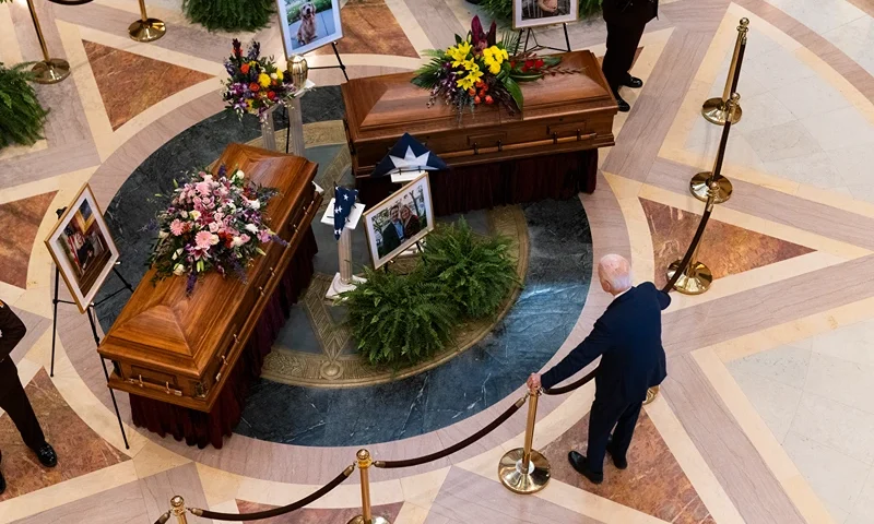 Former U.S. President Joe Biden looks on as DFL Rep. Melissa Hortman, her husband Mark Hortman, and their dog Gilbert lie in state in the rotunda of the Capitol building on June 27, 2025 in St. Paul, Minnesota. Law enforcement agencies captured Vance Boelter on June 15th in connection with the killing of Rep. Hortman and her husband, Mark, who were shot at their home on June 14th. DFL State Sen. John Hoffman and his wife were also shot and hospitalized in a separate incident. Minnesota Gov. Tim Walz said during a press conference that the shooting "appears to be a politically motivated assassination." (Photo by Stephen Maturen/Getty Images)