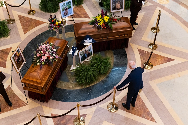 Former U.S. President Joe Biden looks on as DFL Rep. Melissa Hortman, her husband Mark Hortman, and their dog Gilbert lie in state in the rotunda of the Capitol building on June 27, 2025 in St. Paul, Minnesota. Law enforcement agencies captured Vance Boelter on June 15th in connection with the killing of Rep. Hortman and her husband, Mark, who were shot at their home on June 14th. DFL State Sen. John Hoffman and his wife were also shot and hospitalized in a separate incident. Minnesota Gov. Tim Walz said during a press conference that the shooting "appears to be a politically motivated assassination." (Photo by Stephen Maturen/Getty Images)