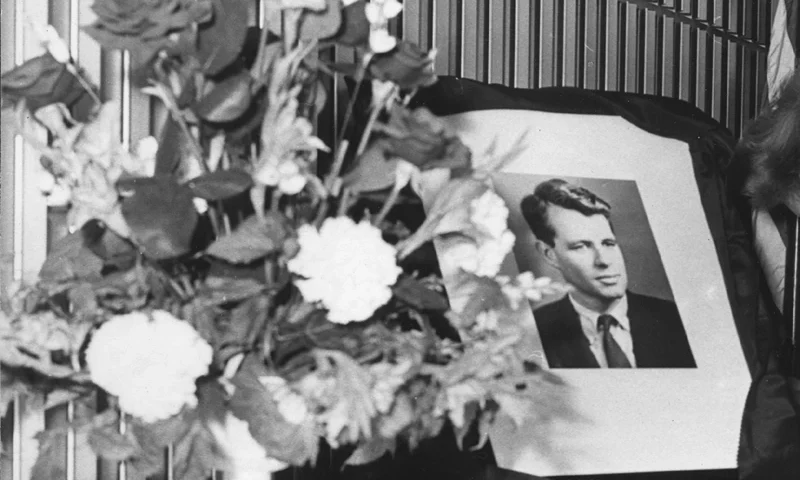 A woman signing the book of condolences for Senator Robert Kennedy at the American Embassy in London. (Photo by Michael Webb/Getty Images)