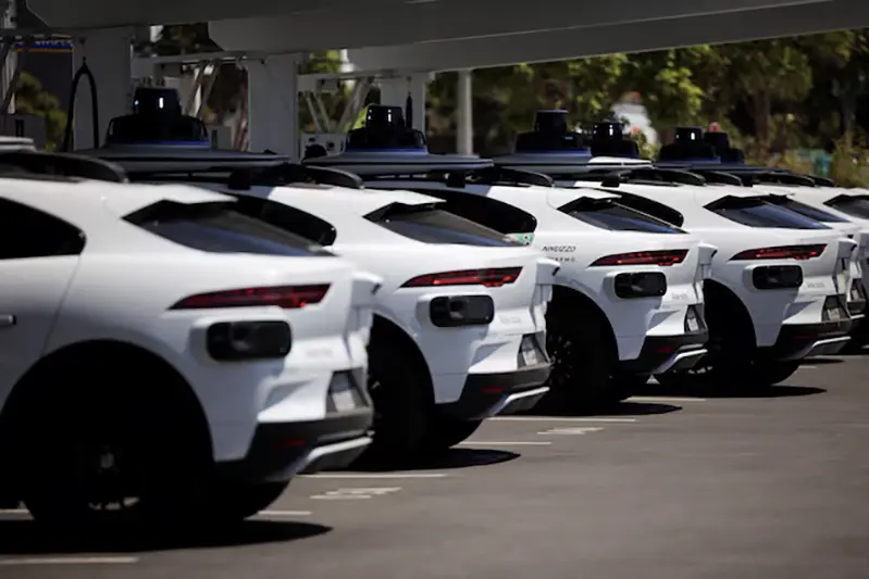 Waymo driverless vehicles charge at a Waymo charging station in Santa Monica, California, U.S., May 30, 2025. REUTERS/Daniel Cole/File Photo