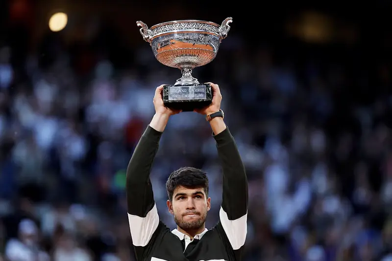 Spain's Carlos Alcaraz celebrates with the trophy after winning the men's singles final against Italy's Jannik Sinner REUTERS/Stephanie Lecocq