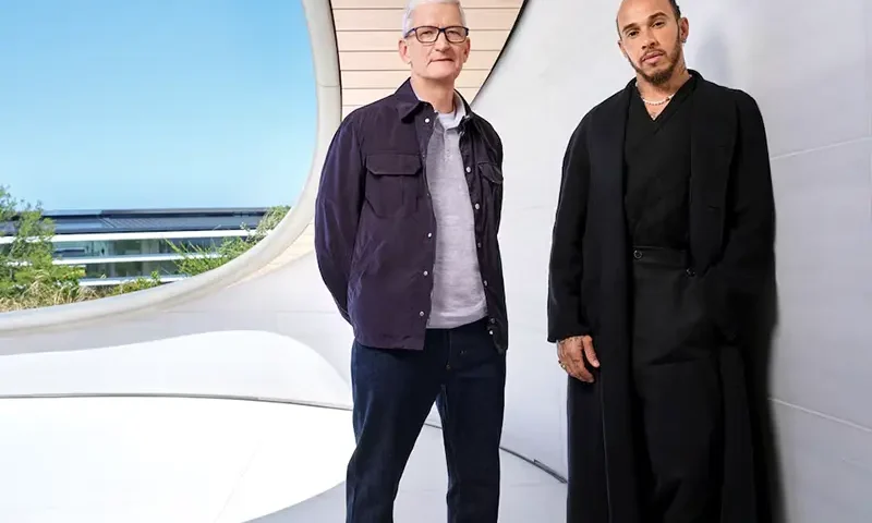 Apple CEO Tim Cook and Formula One driver Lewis Hamilton pose for a publicity photo at Apple Park in Cupertino, California, U.S., April 28, 2025. Apple/Handout via REUTERS