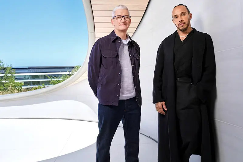 Apple CEO Tim Cook and Formula One driver Lewis Hamilton pose for a publicity photo at Apple Park in Cupertino, California, U.S., April 28, 2025. Apple/Handout via REUTERS
