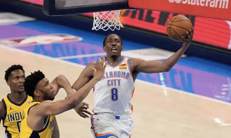 Oklahoma City Thunder forward Jalen Williams (8) shoots against Indiana Pacers center Tony Bradley (13) during the third quarter of game five of the 2025 NBA Finals at Paycom Center. Mandatory Credit: Kyle Terada-Imagn Images