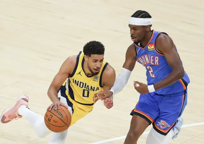 Indiana Pacers guard Tyrese Haliburton (0) drives to the basket against Oklahoma City Thunder guard Shai Gilgeous-Alexander (2) in the first quarter during game six of the 2025 NBA Finals at Gainbridge Fieldhouse. Mandatory Credit: Trevor Ruszkowski-Imagn Images