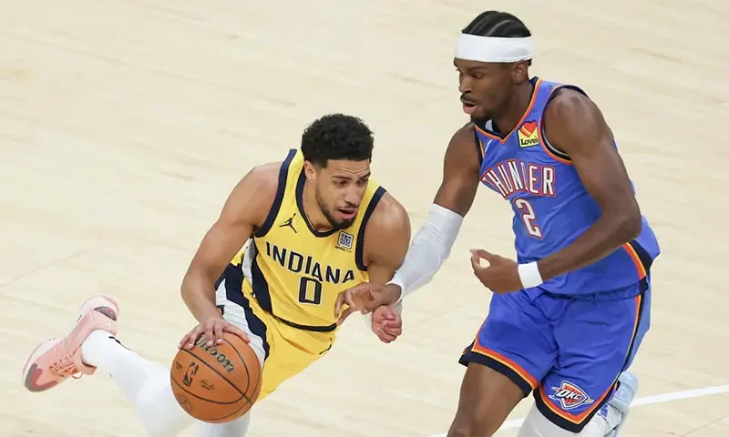Indiana Pacers guard Tyrese Haliburton (0) drives to the basket against Oklahoma City Thunder guard Shai Gilgeous-Alexander (2) in the first quarter during game six of the 2025 NBA Finals at Gainbridge Fieldhouse. Mandatory Credit: Trevor Ruszkowski-Imagn Images