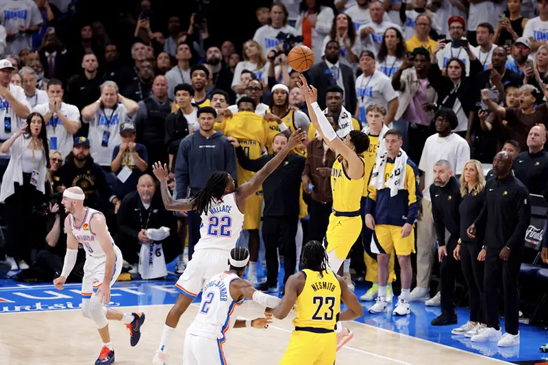 Indiana Pacers guard Tyrese Haliburton (0) makes the game winning shot over Oklahoma City Thunder guard Cason Wallace (22) during the fourth quarter during game one of the 2025 NBA Finals at Paycom Center. Mandatory Credit: Alonzo Adams-Imagn Images
