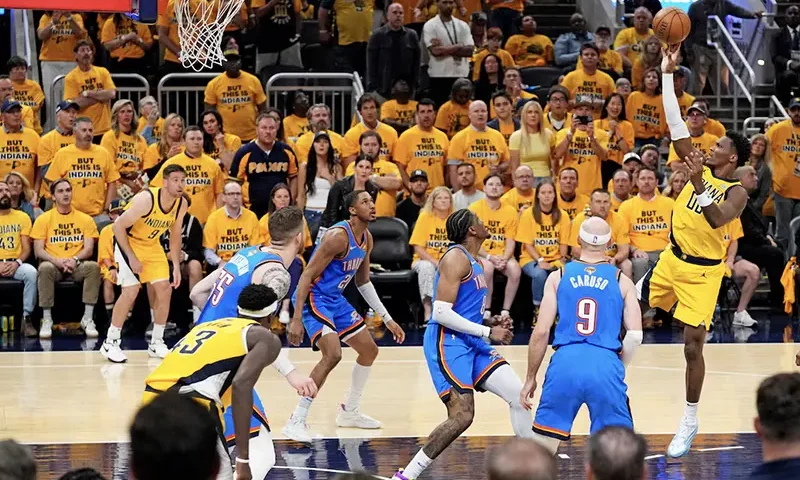 Indiana Pacers guard Bennedict Mathurin (00) shoots the ball against Oklahoma City Thunder guard Alex Caruso (9) in game three of the 2025 NBA Finals at Gainbridge Fieldhouse. Mandatory Credit: Kyle Terada-Imagn Images