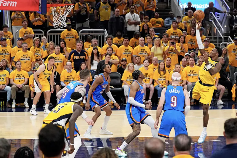 Indiana Pacers guard Bennedict Mathurin (00) shoots the ball against Oklahoma City Thunder guard Alex Caruso (9) in game three of the 2025 NBA Finals at Gainbridge Fieldhouse. Mandatory Credit: Kyle Terada-Imagn Images