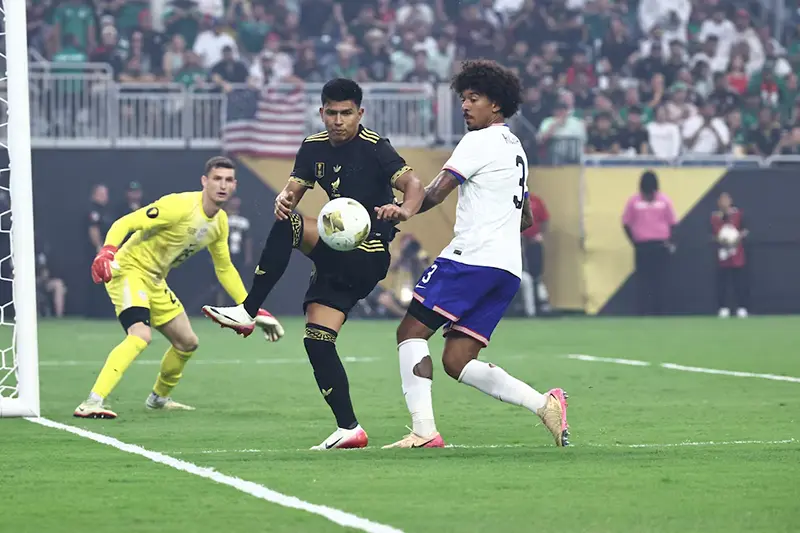 Mexico defender Jesus Gallardo (23) battles for the ball with United States defender Chris Richards (3) in front of United States goalkeeper Matthew Freese (25) in the second half during the 2025 Gold Cup Final at NRG Stadium. Mandatory Credit: Kevin Jairaj-Imagn Image
