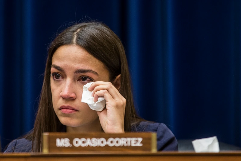 WASHINGTON, DC - JULY 10: Rep. Alexandria Ocasio-Cortez (D-NY) wipes a tear during a House Oversight and Reform subcommittee on Civil Rights and Civil Liberties hearing discussing migrant detention centers' treatment of children on Capitol Hill on July 10, 2019 in Washington, DC. Yazmin Juarez, whose 19-month-old daughter Mariee died after detention by ICE testified. (Photo by Zach Gibson/Getty Images)