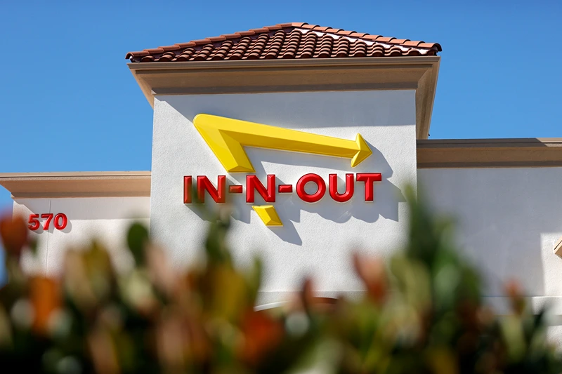 PLEASANT HILL, CALIFORNIA - OCTOBER 28: The In-n-Out logo is displayed on the front of an In-n-Out restaurant on October 28, 2021 in Pleasant Hill, California. Contra Costa county health officials shut down an In-n-Out restaurant in Pleasant Hill on Tuesday after the popular burger chain ignored repeated warnings to check the vaccination cards of customers who wanted to dine indoors. San Francisco health officials shut down the Fisherman's Wharf location for several days earlier in the month for the same issue. That location is currently only offering to go orders. (Photo by Justin Sullivan/Getty Images)
