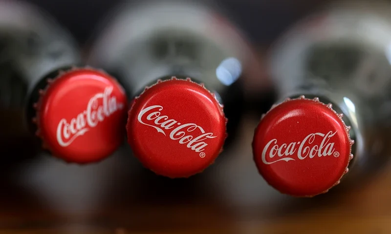 SAN ANSELMO, CALIFORNIA - APRIL 24: In this photo illustration, bottles of Coca Cola are displayed on April 24, 2023 in San Anselmo, California. Coca-Cola reported first-quarter earnings that beat analyst expectations with revenues of $10.96 billion compared to the expected $10.8 billion. (Photo Illustration by Justin Sullivan/Getty Images)