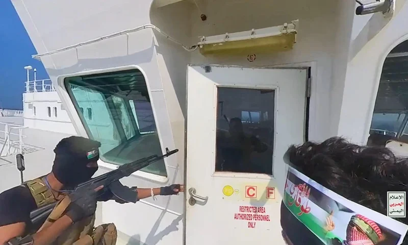 INTERNATIONAL WATERS RED SEA, YEMEN - NOVEMBER 20: This handout screen grab captured from a video shows Yemen's Houthi fighters' takeover of the Galaxy Leader Cargo in the Red Sea coast off Hudaydah, on November 20, 2023 in the Red Sea, Yemen. On Monday, the Houthi movement in Yemen released footage and photos of the Houthi-run coastguard taking over the Israeli-linked Galaxy Leader Vessel in the Red Sea, which had 52 people onboard. Galaxy Leader is owned by Galaxy Maritime Ltd in the Isle of Man and is linked to Israeli businessman Abraham Ungar through Ray Car Carriers. (Photo by Houthi Movement via Getty Images)
