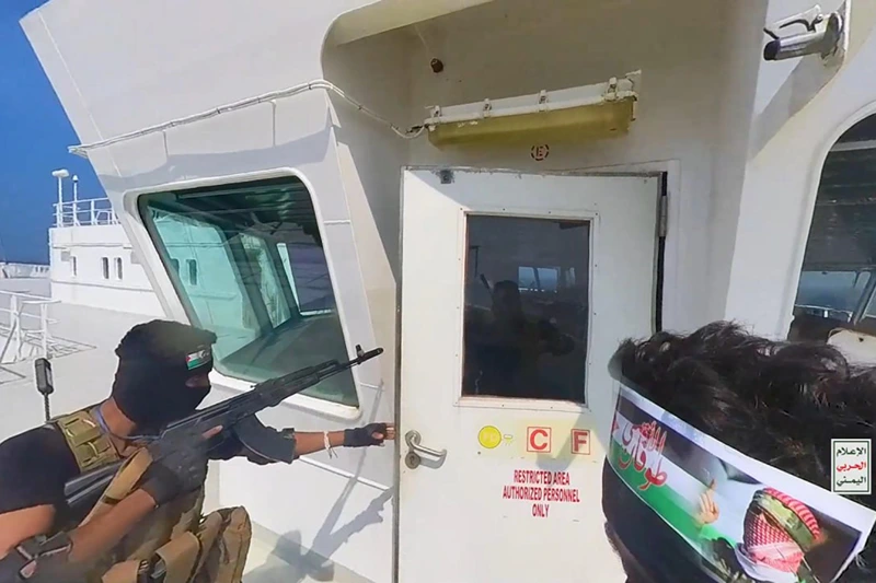 INTERNATIONAL WATERS RED SEA, YEMEN - NOVEMBER 20: This handout screen grab captured from a video shows Yemen's Houthi fighters' takeover of the Galaxy Leader Cargo in the Red Sea coast off Hudaydah, on November 20, 2023 in the Red Sea, Yemen. On Monday, the Houthi movement in Yemen released footage and photos of the Houthi-run coastguard taking over the Israeli-linked Galaxy Leader Vessel in the Red Sea, which had 52 people onboard. Galaxy Leader is owned by Galaxy Maritime Ltd in the Isle of Man and is linked to Israeli businessman Abraham Ungar through Ray Car Carriers. (Photo by Houthi Movement via Getty Images)
