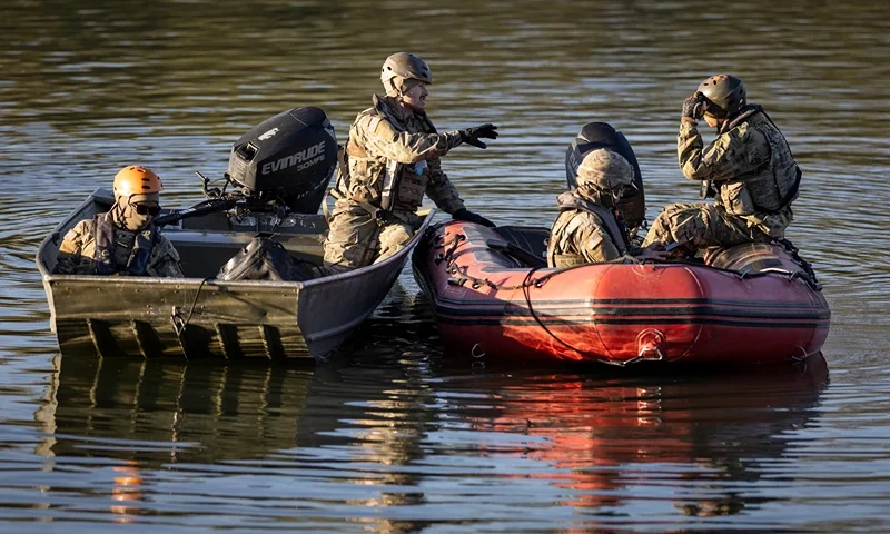 EAGLE PASS, TEXAS - JANUARY 09: U.S. National Guard soldiers stop to talk while patrolling the Rio Grande at the U.S.-Mexico border on January 09, 2024 in Eagle Pass, Texas. Immigrant crossings in the area have dipped dramatically since a major surge in the last months of 2023. (Photo by John Moore/Getty Images)
