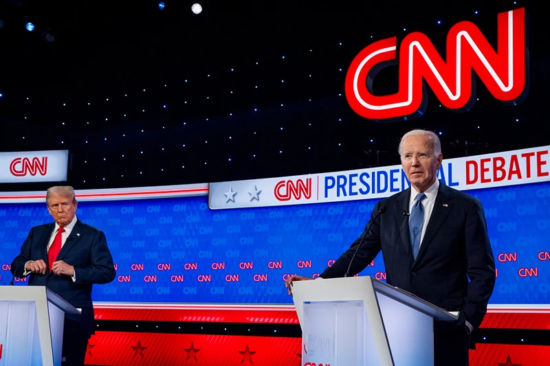 WASHINGTON, DC - JUNE 27: Republican presidential candidate, former President Donald Trump (L) looks at U.S. President Joe Biden during the CNN Presidential Debate at the CNN Studios on June 27, 2024 in Atlanta, Georgia. The debate is the first of two scheduled between the two candidates before the November election. (Photo by Andrew Harnik/Getty Images)