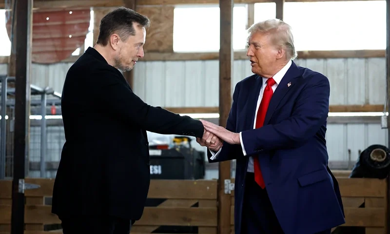 BUTLER, PENNSYLVANIA - OCTOBER 05: Elon Musk (L) shakes hands with Republican presidential nominee, former President Donald Trump back stage during a campaign rally at the Butler Farm Show grounds on October 05, 2024 in Butler, Pennsylvania. This is the first time that Trump has returned to Butler since he was injured during an attempted assassination on July 13. (Photo by Anna Moneymaker/Getty Images)