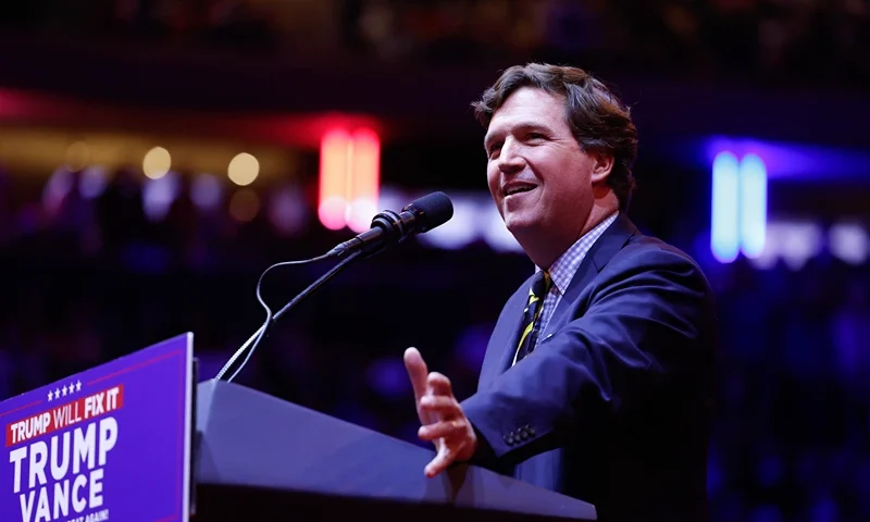 NEW YORK, NEW YORK - OCTOBER 27: Tucker Carlson speaks before Republican presidential nominee, former U.S. President Donald Trump takes the stage at the campaign rally at Madison Square Garden on October 27, 2024 in New York City. Trump closed out his weekend of campaigning in New York City with a guest list of speakers that includes his running mate Republican vice presidential nominee, Sen. J.D. Vance (R-OH), Tesla CEO Elon Musk, UFC CEO Dana White, and House Speaker Mike Johnson (R-LA), among others, nine days before Election Day. (Photo by Anna Moneymaker/Getty Images)