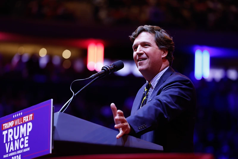 NEW YORK, NEW YORK - OCTOBER 27: Tucker Carlson speaks before Republican presidential nominee, former U.S. President Donald Trump takes the stage at the campaign rally at Madison Square Garden on October 27, 2024 in New York City. Trump closed out his weekend of campaigning in New York City with a guest list of speakers that includes his running mate Republican vice presidential nominee, Sen. J.D. Vance (R-OH), Tesla CEO Elon Musk, UFC CEO Dana White, and House Speaker Mike Johnson (R-LA), among others, nine days before Election Day. (Photo by Anna Moneymaker/Getty Images)