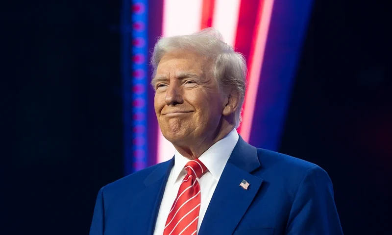 PHOENIX, ARIZONA - DECEMBER 22: U.S. President-elect Donald Trump smiles during Turning Point USA's AmericaFest at the Phoenix Convention Center on December 22, 2024 in Phoenix, Arizona. The annual four day conference geared toward energizing and connecting conservative youth hosts some of the country's leading conservative politicians and activists. (Photo by Rebecca Noble/Getty Images