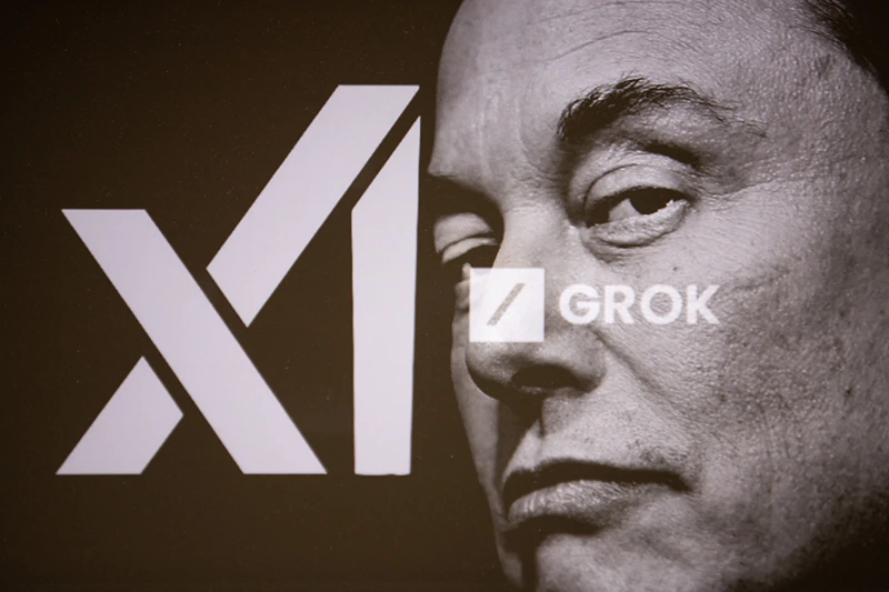 Double exposure photograph of a portrait of elon musk and a telephone displaying the grok artificial intelligence logo in Kerlouan in Brittany in France on February 18 2025. (Photo by Vincent Feuray / Hans Lucas / Hans Lucas via AFP) (Photo by VINCENT FEURAY/Hans Lucas/AFP via Getty Images)