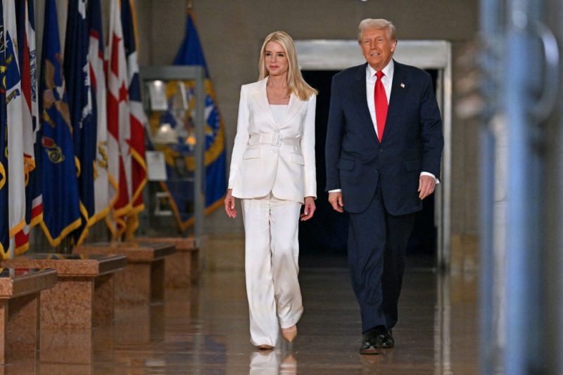 US President Donald Trump and US Attorney General Pam Bondi (L) arrive to speak at the Department of Justice in Washington, DC, on March 14, 2025. (Photo by ROBERTO SCHMIDT / AFP) (Photo by ROBERTO SCHMIDT/AFP via Getty Images)