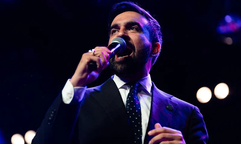 Zohran Mamdani speaks enthusiastically into the microphone at a rally at Brooklyn Steel in Brooklyn New York on May 4 2025. (Photo by Madison Swart / Hans Lucas / Hans Lucas via AFP) (Photo by MADISON SWART/Hans Lucas/AFP via Getty Images)