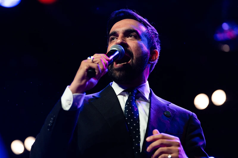 Zohran Mamdani speaks enthusiastically into the microphone at a rally at Brooklyn Steel in Brooklyn New York on May 4 2025. (Photo by Madison Swart / Hans Lucas / Hans Lucas via AFP) (Photo by MADISON SWART/Hans Lucas/AFP via Getty Images)
