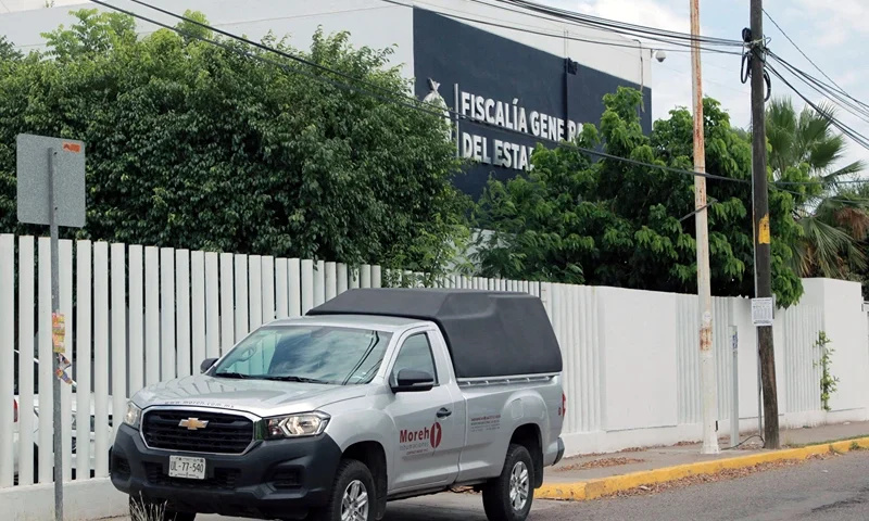 View of the Sinaloa State Attorney General's Office, where 20 bodies found on the "El Seminario" bridge were taken in Culiacan, Mexico, on June 30, 2025. Twenty bodies, several of them decapitated, were found on a highway bridge in a part of Mexico where factions of the Sinaloa drug cartel are fighting each other, authorities said Monday. Several headless corpses were found by the roadside, while 16 more bodies were discovered inside a vehicle abandoned at the scene, the Sinaloa state prosecutor's office said. (Photo by Ivan MEDINA / AFP) (Photo by IVAN MEDINA/AFP via Getty Images)