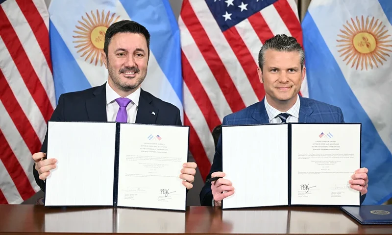 US Defense Secretary Pete Hegseth (R) and Argentina's Defense Minister Luis Petri hold a signed agreement for the sell of M1126 Stryker vehicles to Argentina at the Pentagon in Washington, DC on July 2, 2025. (Photo by Mandel NGAN / AFP) (Photo by MANDEL NGAN/AFP via Getty Images)