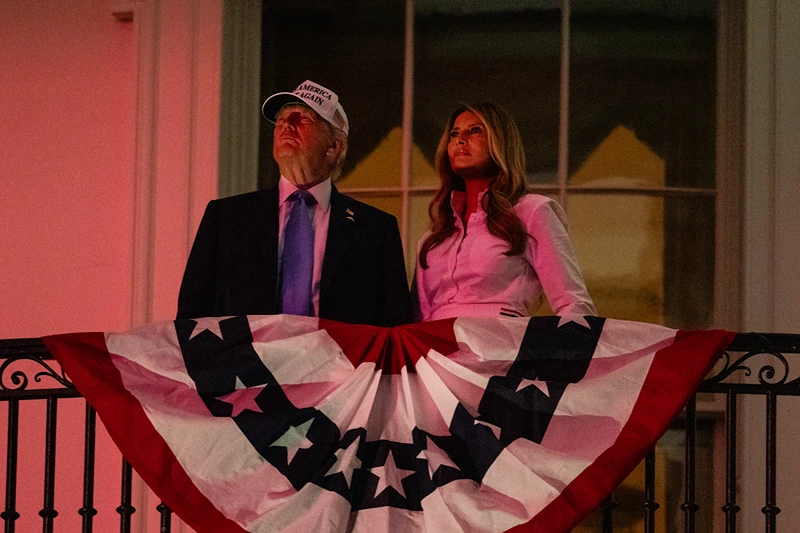 WASHINGTON, DC - JULY 04: President Donald Trump and First Lady Melania Trump watch fireworks during a Fourth of July celebration at the White House on July 4, 2025 in Washington, DC. The Independence Day celebrations come a day after the House of Representatives passed President Donald Trump's "Big, Beautiful Bill," which he signed earlier in the day. (Photo by Eric Lee/Getty Images)