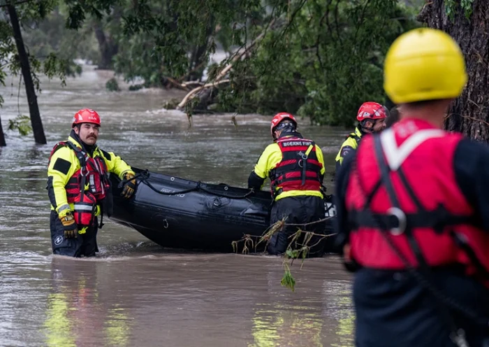 COMFORT, TEXAS - JULY 04: Boerne search and rescue team members prepare their Zodiac boat for operations on the flooded Guadalupe River on July 4, 2025 in Comfort, Texas. Heavy rainfall caused flooding along the Guadalupe River in central Texas with multiple fatalities reported. (Photo by Eric Vryn/Getty Images)